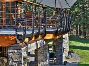 Stone pillars and curved deck posts fascia mounted