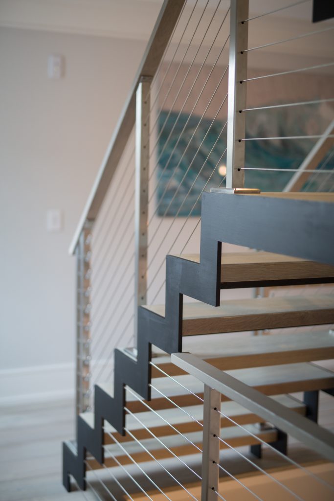 Greenwich modern staircase with zigzag stringer and cable railing