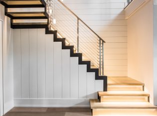 Modern staircase with floating stairs and wood landing