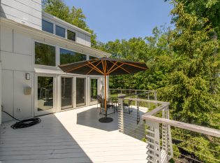 Upper level deck with modern railing system