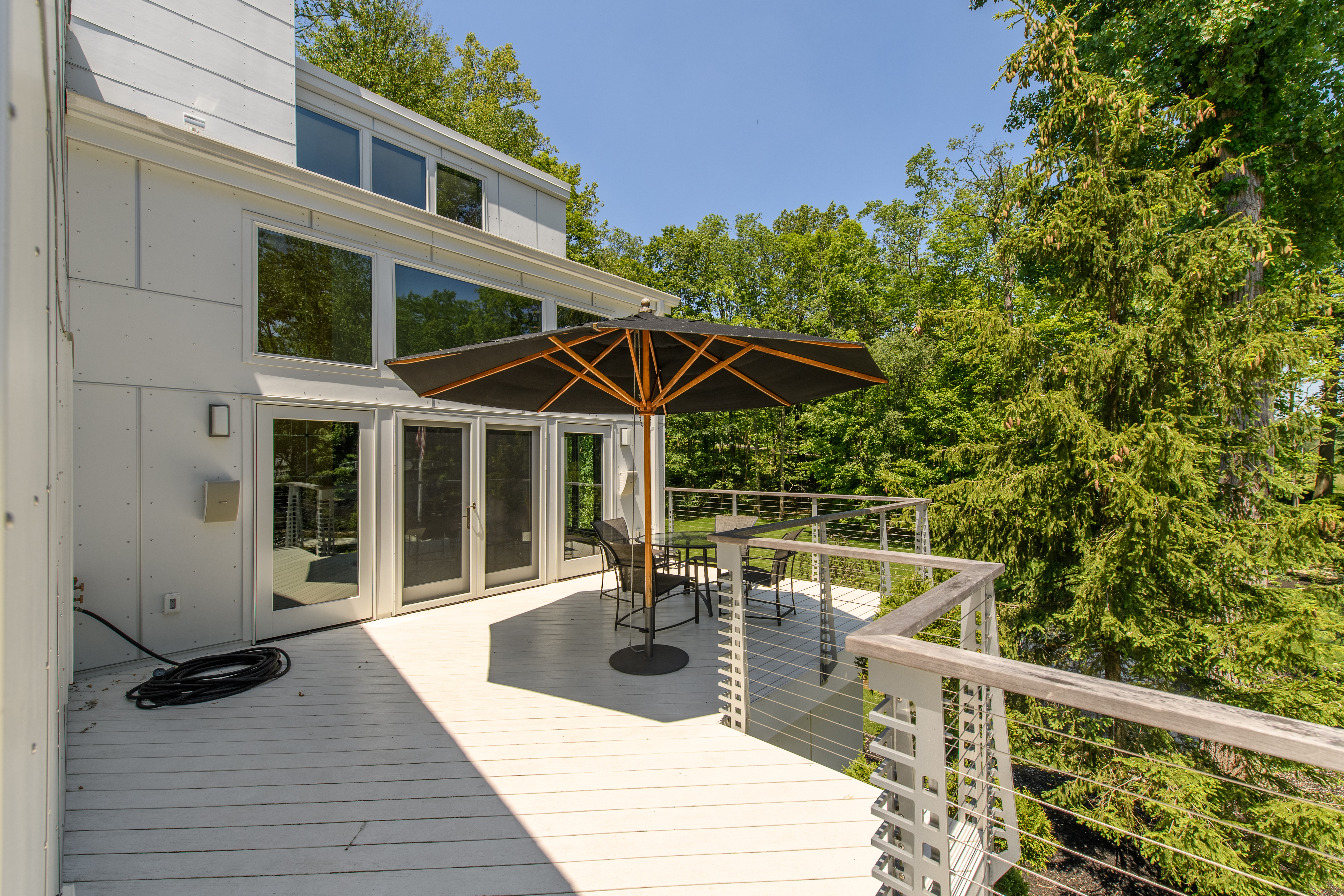 Upper level deck with modern railing system