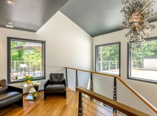 Industrial style railing on second story living space.