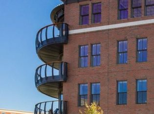 Curved railing on multi-level luxury condominium