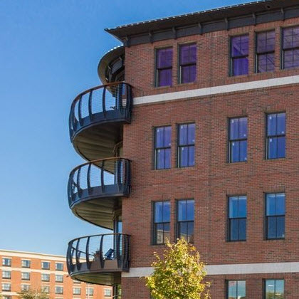 Curved railing on multi-level luxury condominium
