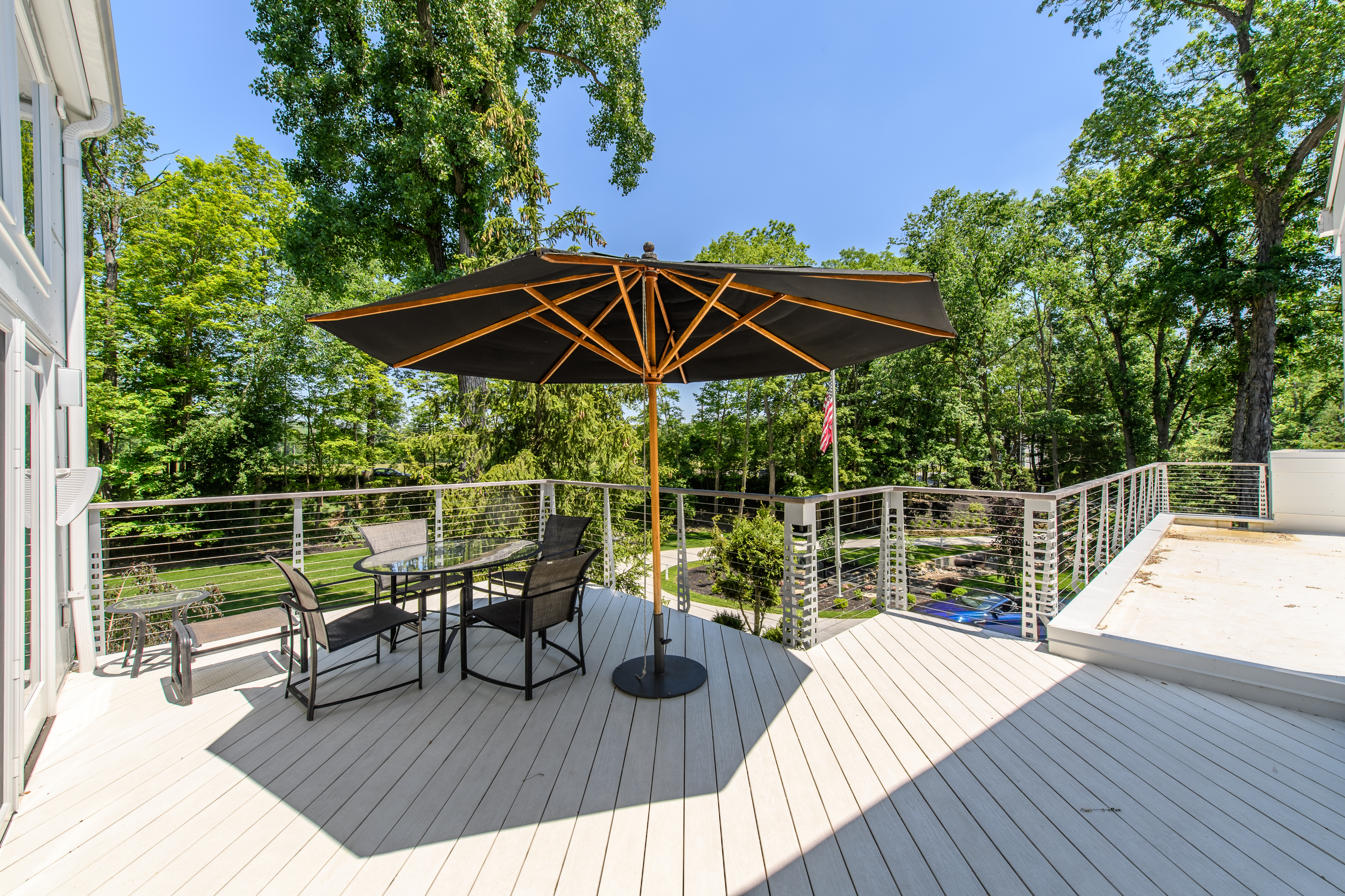 Outdoor dining with Keuka Studios Chicago style railing