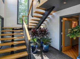 Custom mono-stringer steel stair with wood treads.