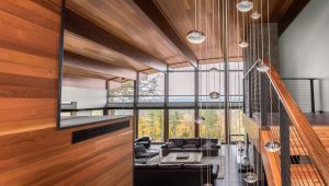 Black cable railing in mountain home interior.