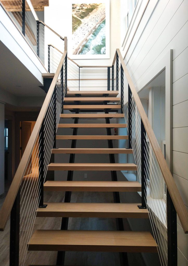 Contemporary staircase with cable railing for Nantucket home