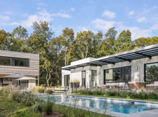 Pool view of home and pool house