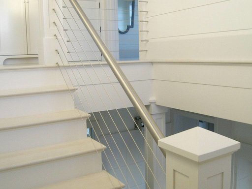 Stainless steel cable railing and round hand rail.