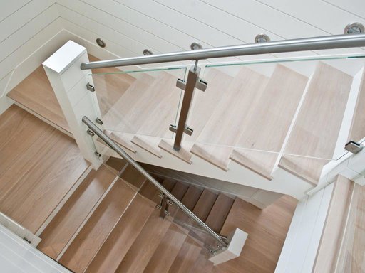 Modern multi-tier staircase with glass railing