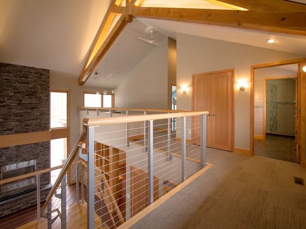 Exposed beam home in Rochester with anodized aluminum cable railing system