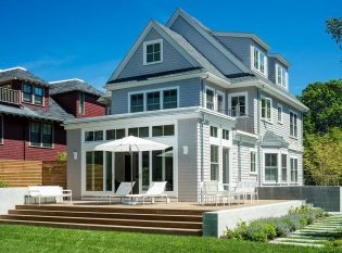 Cambridge home with stainless steel raling on the front porch