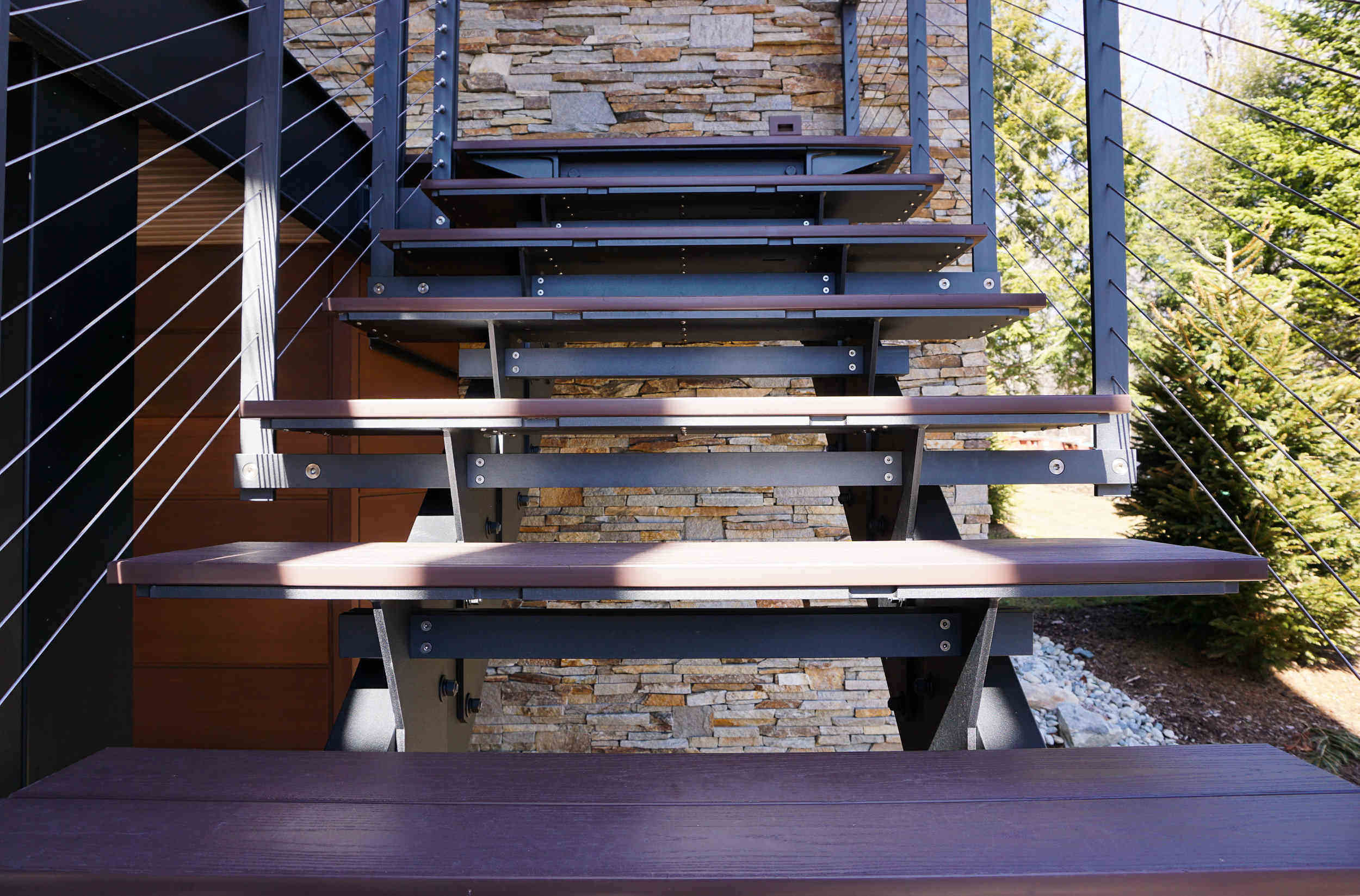 Floating staircase with composite lumber treads