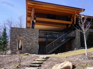 Industrial style floating staircase on home exterior