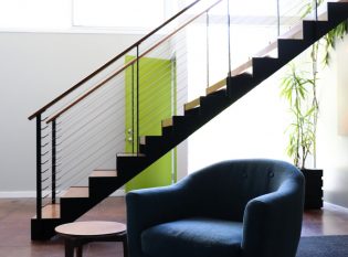 Floating staircase and mid-century modern furniture