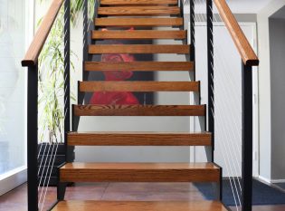 Interior sawtooth floating staircase and Ithaca Style railing