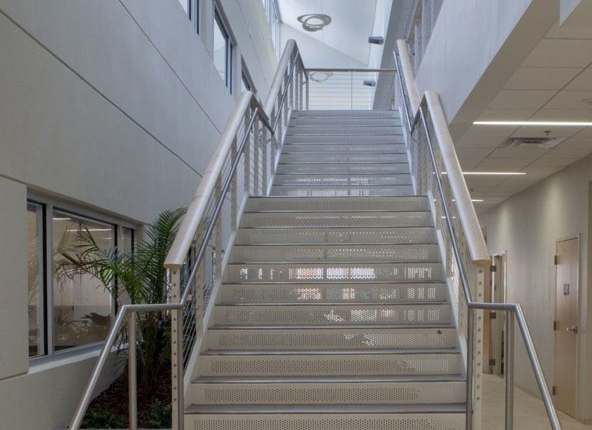 Jacksonville University wide staircase with cable railign and ADA compliant handrail.