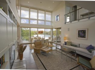 Living room with Ithaca Style cable railing balcony. 