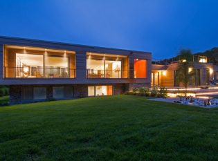 Contemporary Martha's Vineyard home at dusk. 