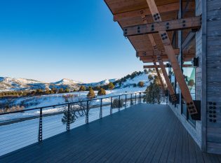 Modern Colorado mountain home with view of snowy mountains