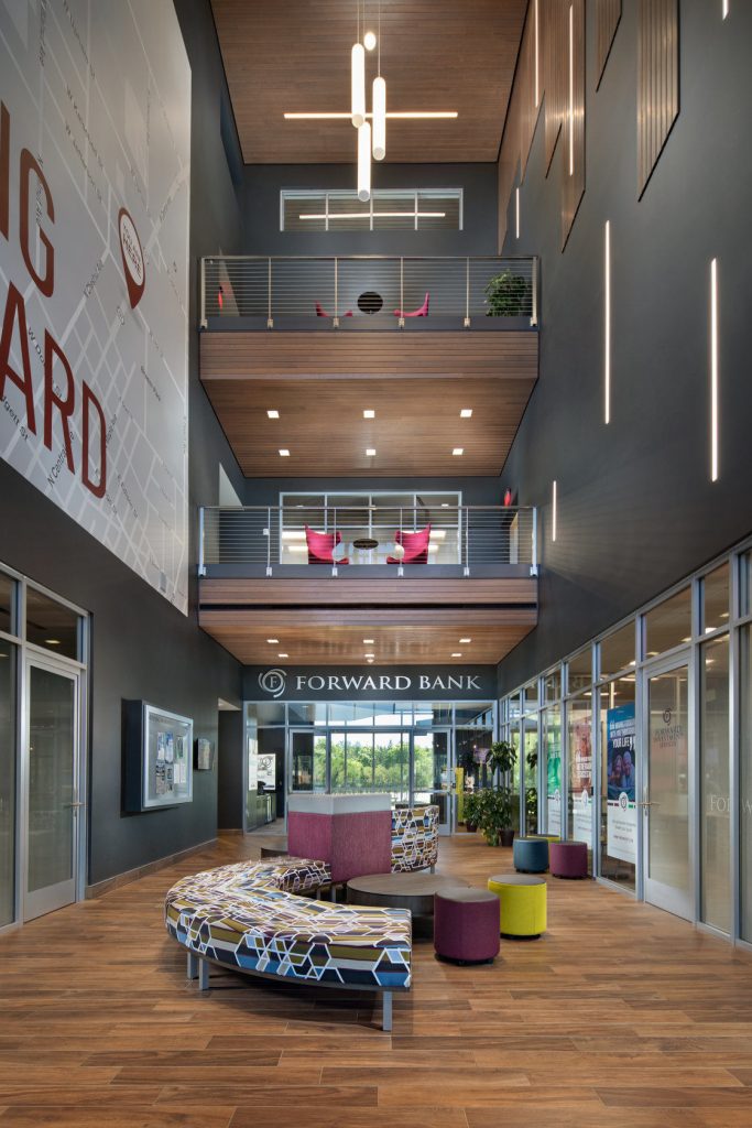 Luxury office building with stainless steel cable railings on balconies.