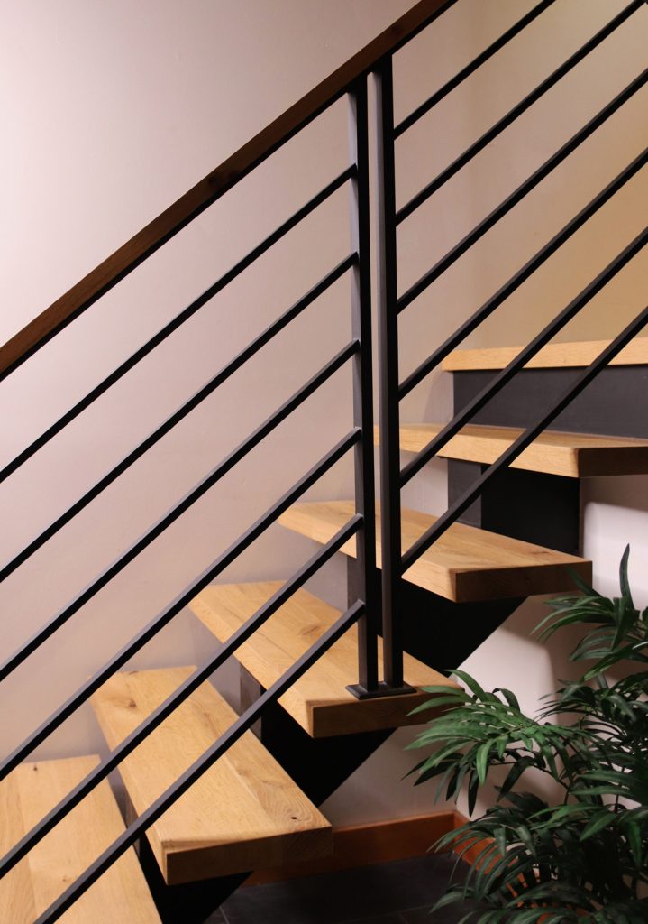 Floating stairs with custom flat bar railing posts