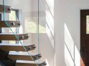 Floating stairs with glass railing