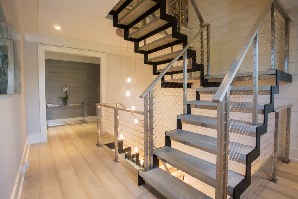 U shaped stairs with custom stainless steel railing