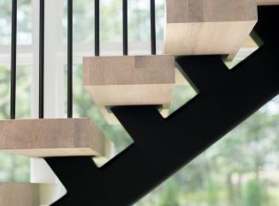 Floating stair and white oak treads with pencil rail