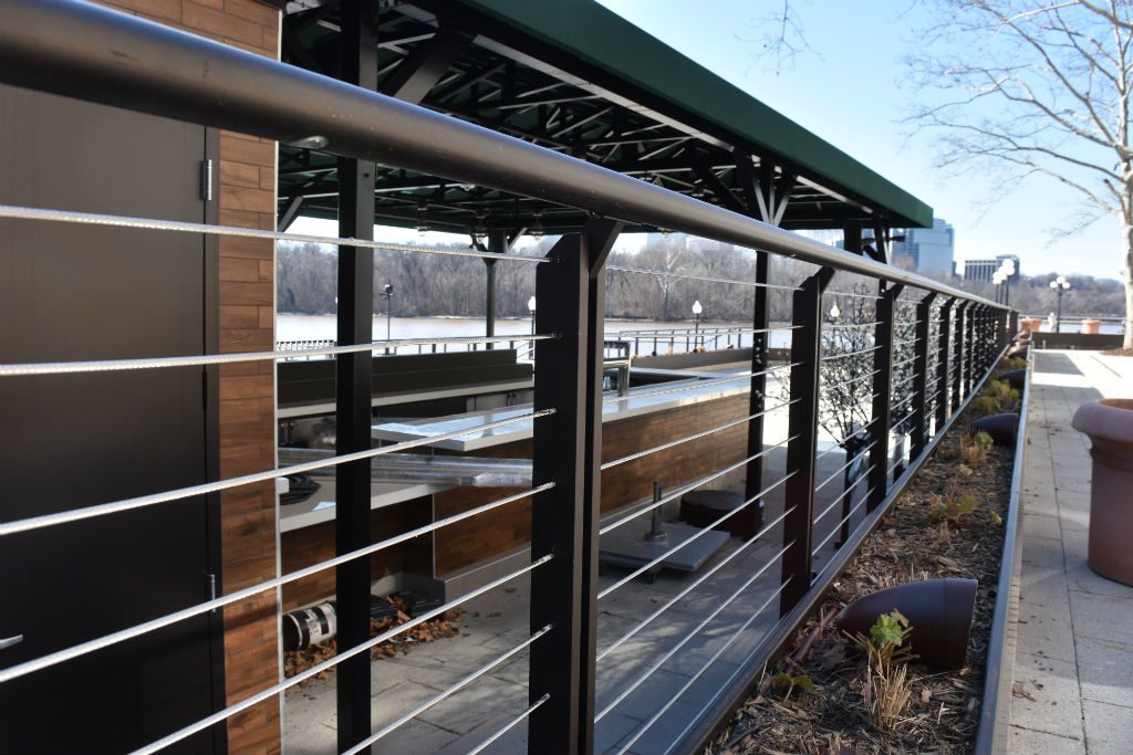 Powder coated cable railing on outside  bar restaurant with LED lighting