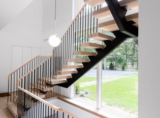 Mono-stringer stairs with white oak treads and top rail