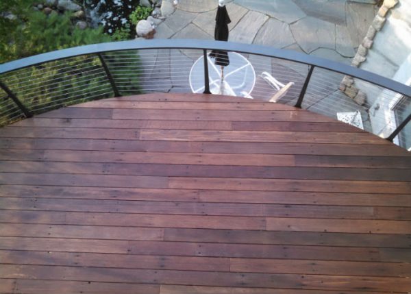 looking down on Curved ipe deck with cable railing