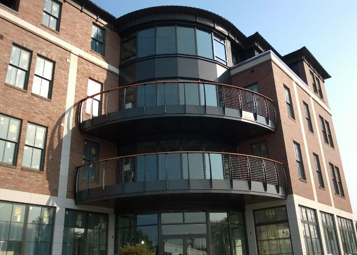 multi-lvedl condominium curved decks with the curved Keuka style railings.