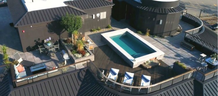 rooftop pool deck with curved cable railing