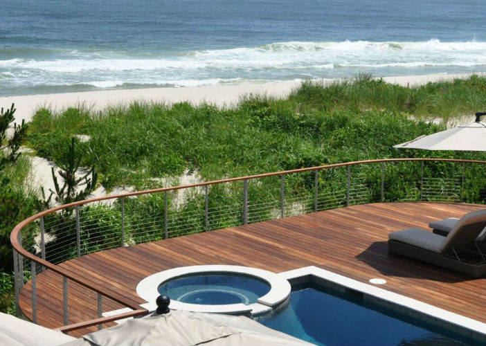 Curved pool deck railing oceanside