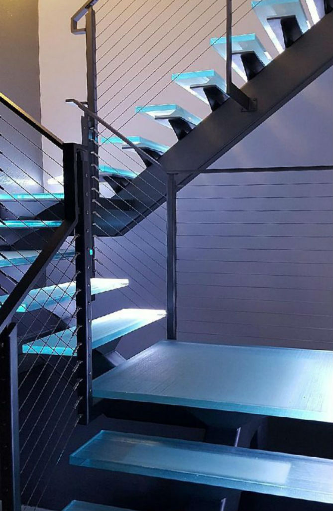 Glass Stair Treads on floating steel stringer stairs with led lighting.