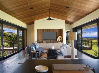 Island style home with Cable railings on deck and bridge