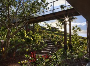 Lush Garden Walkway with Raised Bridge to Main Entry and cable Railings