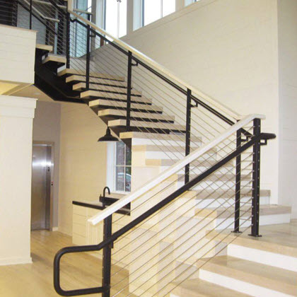 Refined looking railing with black extended railing and maple top rail