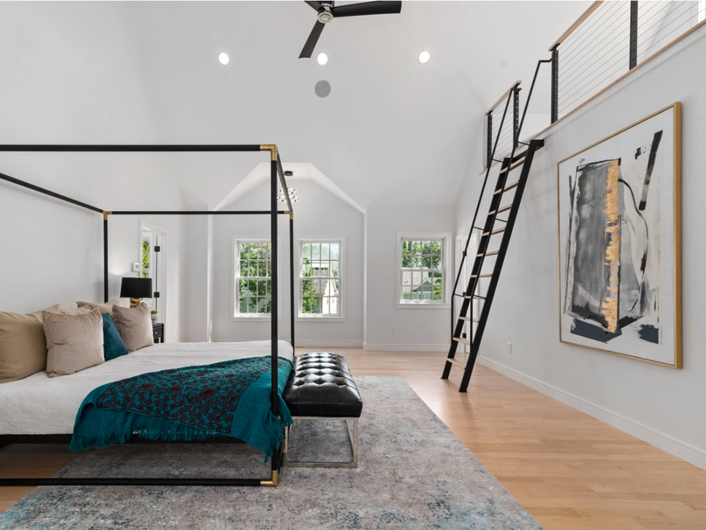 Large Bedroom with steel ladder to loft, cable railings and maple wood treads ant top rail.