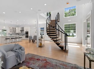 Open living space room with curved stairs