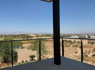 Thick curved railing posts on exterior deck