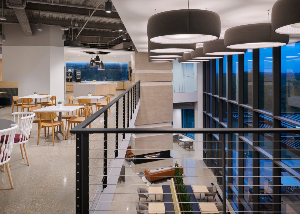 Atrium with thin posts on balcony and cable railings. 