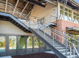 Split Exterior Staircase with Commercial Cable Railings and ADA handrails.