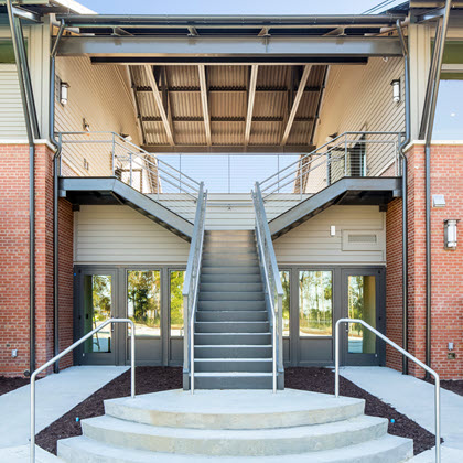 Split Staircase with cable railing system on modern waterfront facility