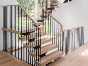 Modern Floating stairs with spindle Railings and white oak treads in the Hamptons 