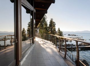 Expansive deck on Lake Tahoe with curved cable railing system