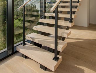 double stringer stairs with glass railing and wood treads
