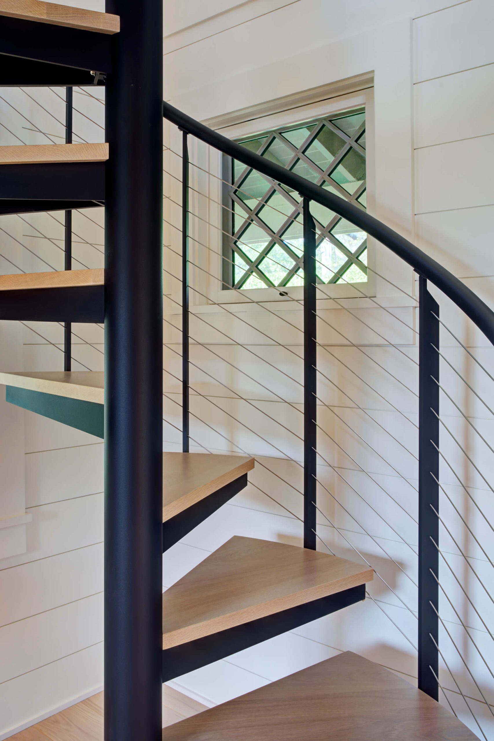 Spiral stair with sleek railing system